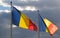 Flag of Romania winding against a spectacular cloudy sky