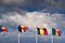 Flag of Romania winding against a spectacular cloudy sky