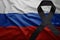 Flag of russia with black mourning ribbon