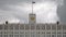 The flag of Russia and The coat of arms of the Russian Federation on the top of The House of the Government