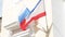 The flag of Russia and the flag of the Republic of Crimea fluttering in the wind