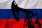 Flag of Russia near the oil rigs. Concept - news from Russia led to higher prices. URALS. Increase in oil production