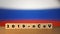 Flag of Russia with outbreak deadly coronavirus covid-19 in background. Wooden blocks with inscription 2019-nCov. Russia flag