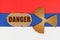 On the flag of Russia, the symbol of radioactivity and torn cardboard with the inscription - Danger