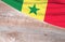 Flag Senegal and space for text on a wooden background