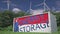 Flag of Singapore and ENERGY STORAGE text on a battery container at wind turbines, 3d animation