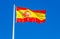 Flag of Spain waving in the wind against the sky