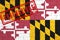 Flag of the State of Maryland painted on grungy wall background