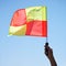 Flag, stop and soccer referee in football match or game wave a foul sign during sport training or workout. Hand, sports