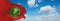 flag of Sultanate of Zanzibar 1963, africa at cloudy sky background, panoramic view. flag representing extinct country,ethnic
