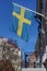 Flag of Sweden waving above the balcony of a building