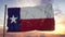 Flag of Texas waving in the wind against deep beautiful sky at sunset