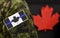 Flag of Thin Blue Line in Canada. Black and white Maple Leaf flag with thin blue line on military uniform. Canada flag with thin