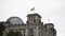 Flag on the top of The German Parliament and the Deutsche Bundestag