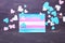 Flag of transgender with hearts on wooden background