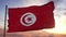 Flag of Tunisia waving in the wind against deep beautiful sky. 3d illustration