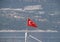 The flag of Turkey flutters in the wind on the deck of pleasure yacht