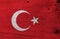 Flag of Turkey on wooden plate background. Grunge Turkey flag texture.