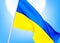 Flag of Ukraine against a clear blue sky. The symbol of patriotism of the Ukrainian nation, a blue-yellow silk banner