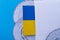 Flag of Ukraine on the background of discs for recording the time.