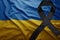 Flag of ukraine with black mourning ribbon