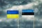 Flag of Ukraine and Estonia. Cloudy sky. Politics. Economy
