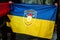Flag of Ukraine with symbol or logo of Luhansk or Lugansk city