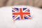 Flag of United Kingdom in sack of sugar sand