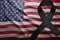 Flag of united states of america with black mourning ribbon