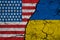 Flag of US and Ukraine on Textured Cracked Earth. The concept of cooperation between the two countries