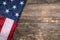 Flag of USA on natural wood table. United States of America. US patriotic symbol. American freedom and Independence.