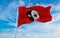 flag of Yinyang ren waving in the wind at cloudy sky. Freedom an