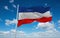 flag of Yugoslavia 1918 1941, Europe at cloudy sky background, panoramic view. flag representing extinct country,ethnic group or