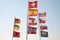 Flagpole with flags in the wind. Flags of: Veneto Region, Germany, Albania, Switzerland, Spain, Austria, Norway, Russia, Czech Rep
