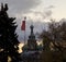 Flagpole with Soviet symbols and a red flag