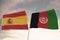 Flags of Afghanistan and Spain waving with cloudy blue sky background, 3D rendering