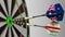 Flags of Australia and Iran on darts hitting bullseye of the target. International cooperation or competition conceptual