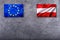 Flags of the Austria and the European Union on concrete background