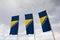 Flags of Bosnia and Herzegovina against blue sky