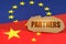 On the flags of China and the European Union lies a cardboard plate with the inscription - Partners