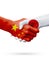Flags China, Japan countries, partnership friendship handshake concept.