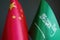 Flags of China and Saudi Arabia as a symbol of diplomacy.