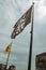 Flags and cloudy sky seen on top of tower of Gravensteen Castle in Ghent.