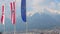 Flags with EU, Austria, Tyrol signs, majestic Alps on background