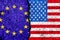 Flags of European Union and USA painted on cracked wall background/European Union versus USA conflict concept