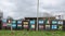 The flags on the fence.