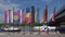 Flags with flowers and coats of arms of Danube cities on the background of the Danube River. Vienna, Austria