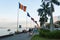 Flags fly in the breeze at the southern end of Riverside Walk, Phnom Penh