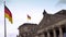 Flags flying outside Reichstag or Deutscher Bundestag German Parliament building in Berlin, Germany