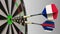 Flags of France and Russia on darts hitting bullseye of the target. International cooperation or competition conceptual